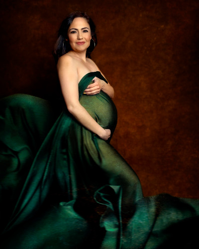 Close-up of expectant mother in gown