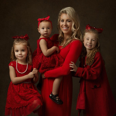 Mother with daughters dressed in red